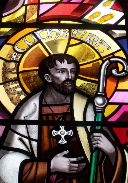 Saint Cuthbert was a monk, bishop and hermit. After his death he became the most important medieval Saint of Northern England, with a cult centred on his tomb at Durham Cathedral. Cuthbert is regarded as the patron Saint of Northumbria. 

<a href="https://commons.wikimedia.org/wiki/File:St_Cuthbert_window.jpg" title="via Wikimedia Commons" target="_blank">User:Andy V Byers</a> [<a href="https://creativecommons.org/licenses/by-sa/3.0" target="_blank">CC BY-SA</a>]